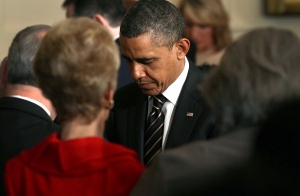 Obama Praying with Head Bowed