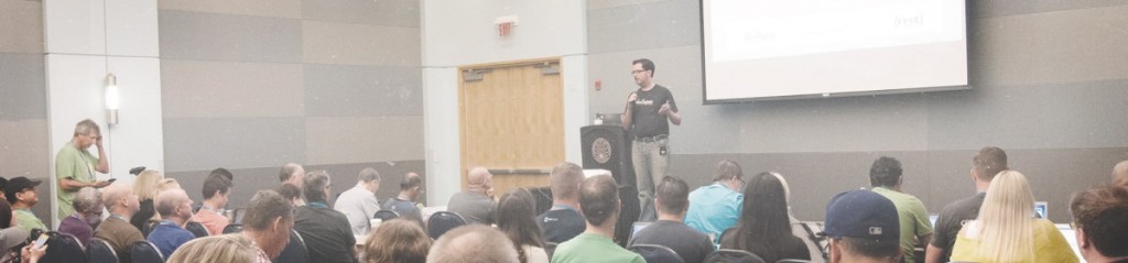 Wide landscape image of Matt Cromwell presenting on a relevant WordPress topic at WordCamp Los Angeles 2015